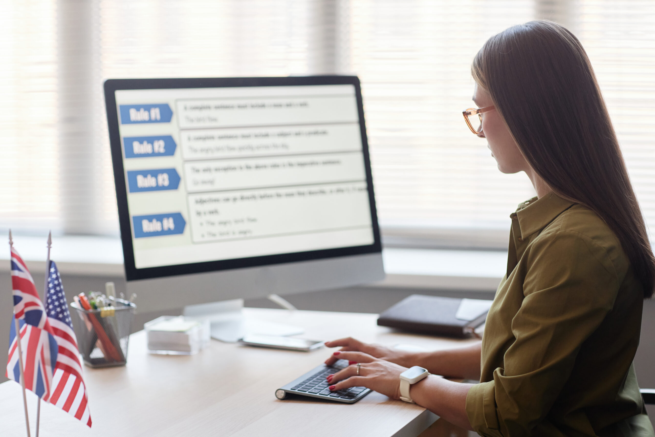 Professional researching job search strategy at a desktop computer