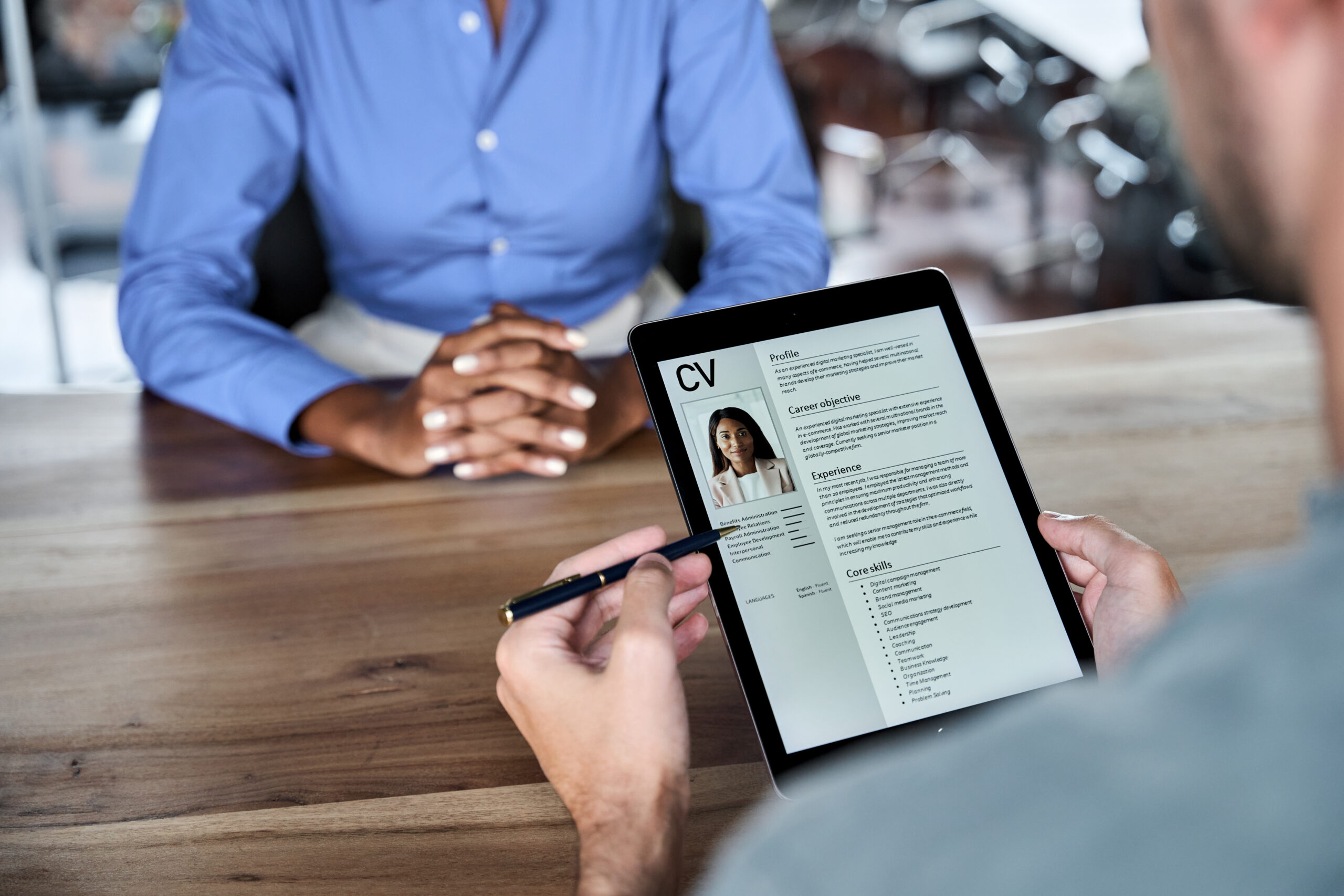 Close-up of a professional reviewing an ATS-compliant résumé
