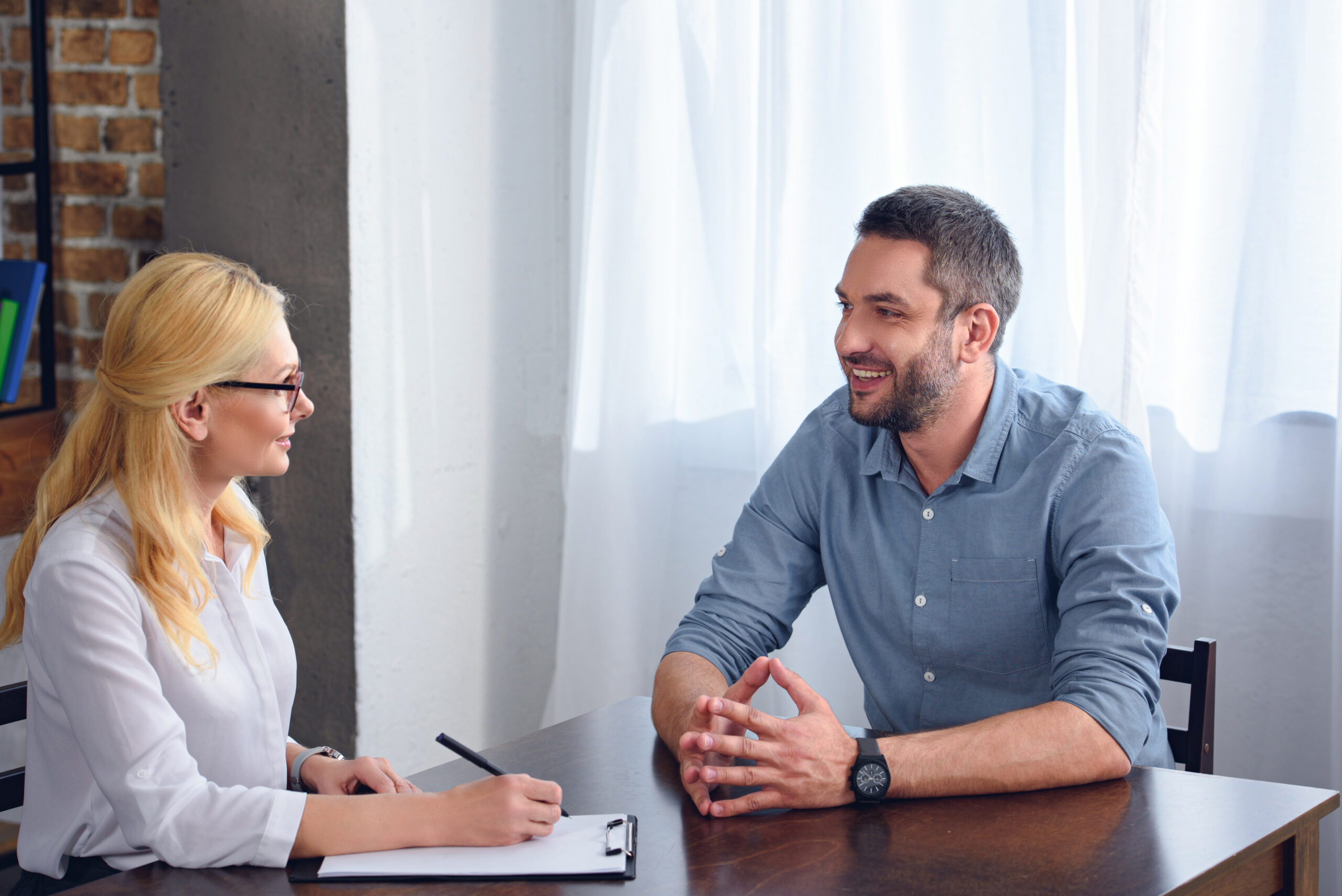 Client in a confident coaching conversation preparing for interviews